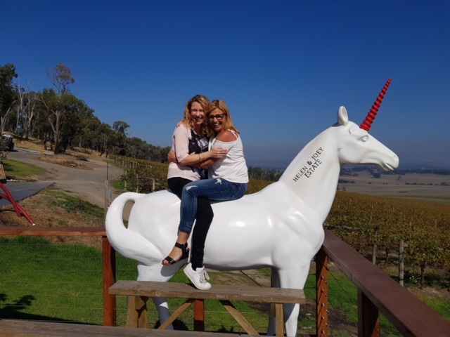 Writer Diane and sister Julie on a unicorn at Helen and Joey Estate winery in the Yarra Valley