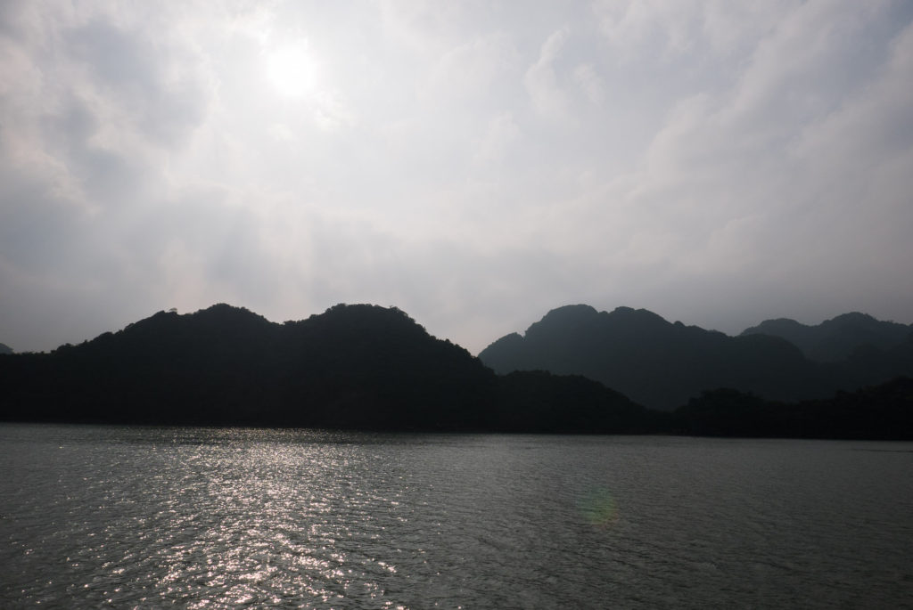 Sunset over the islands on Ha Long Bay.