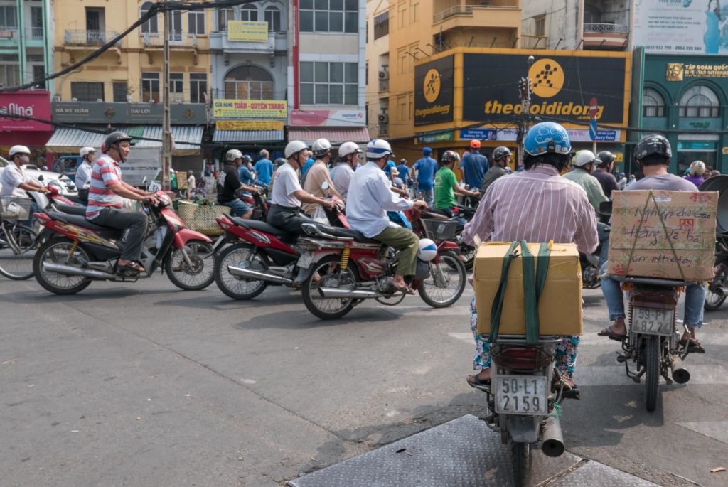 Dozens of bikes fill an intersection in Ho Chi Minh.